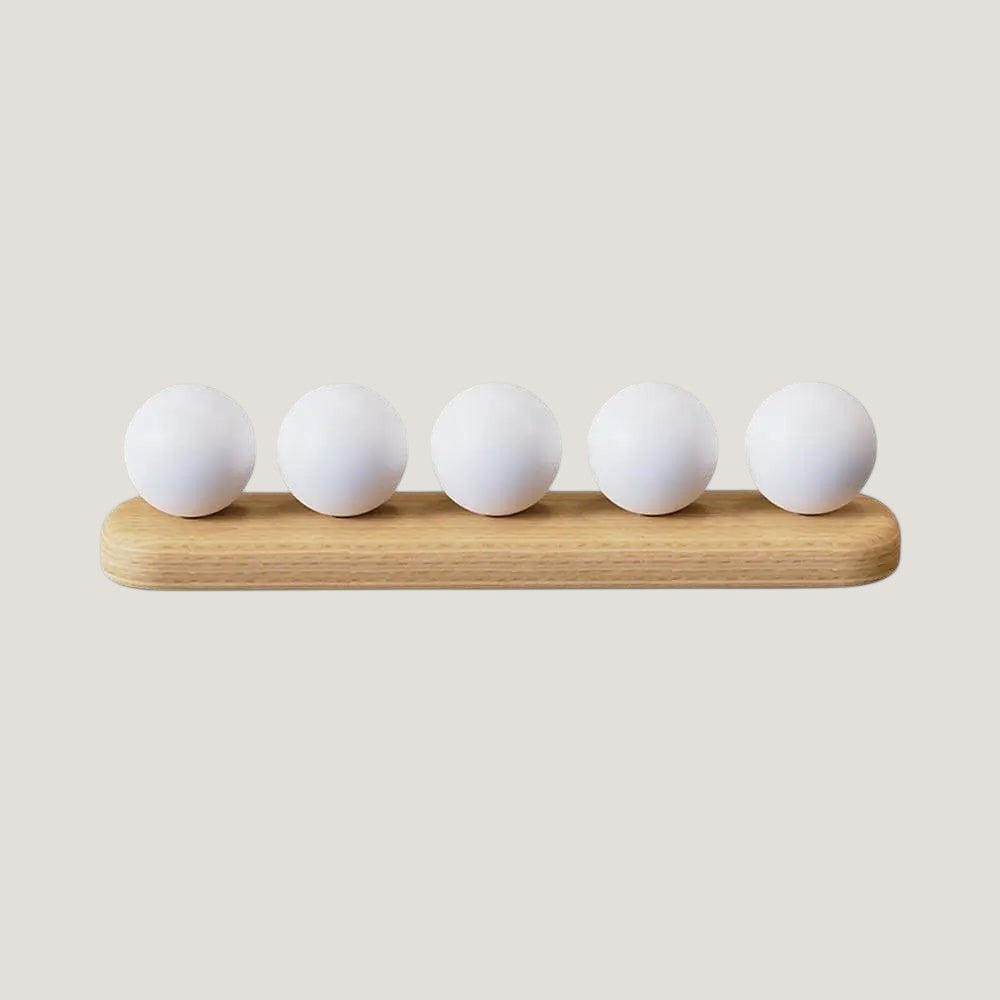 Melora cable organizer with wood base and five white cord holders on a desk