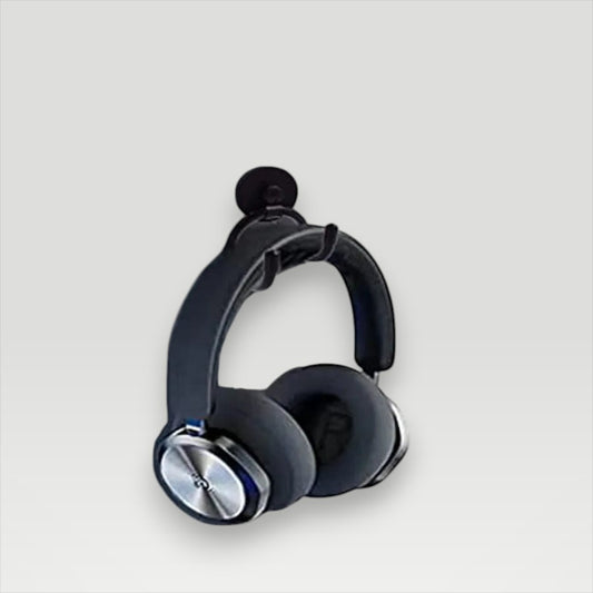 Melora magnetic headphone stand mounted under a desk, holding black full-size headphones