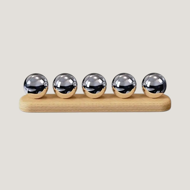 Melora desktop cable organizer with 4 slots in wood and metal, on a light background