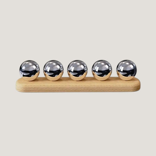 Melora desktop cable organizer with 4 slots in wood and metal, on a light background